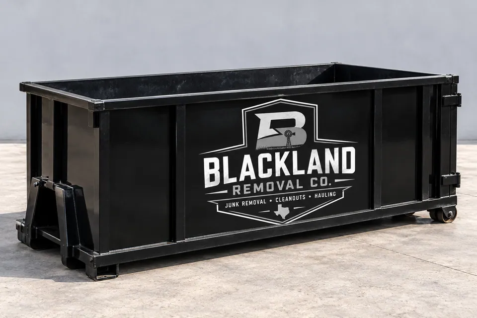 Illustration of a black open-top roll-off dumpster with the Blackland Removal Co. logo on its side